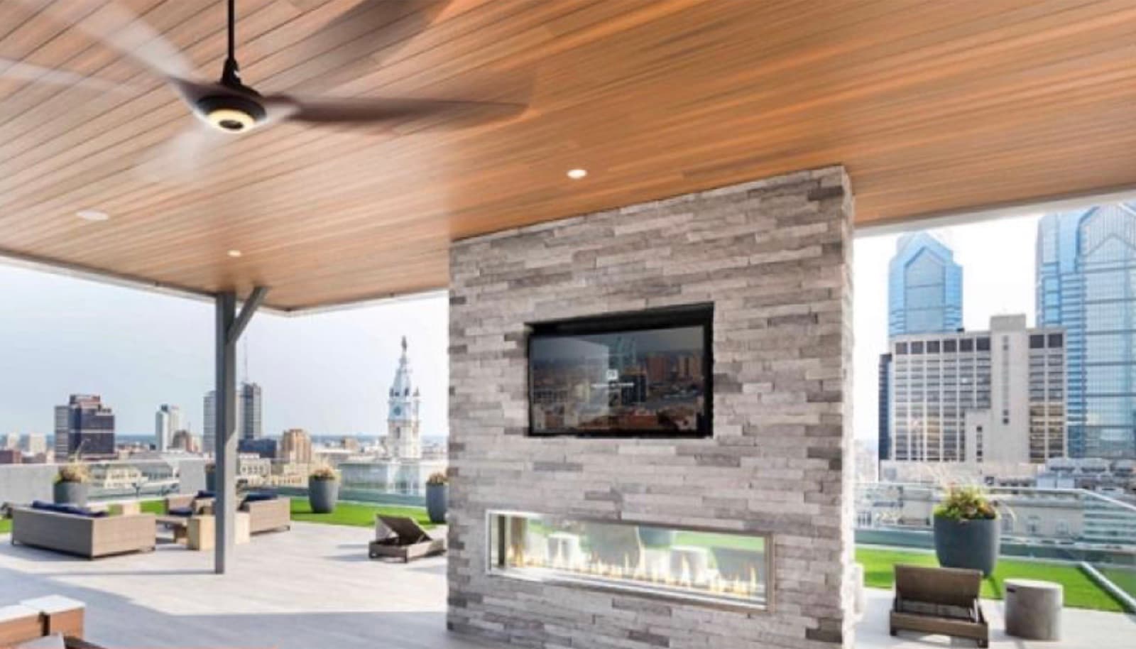 Rooftop terrace with skyline views and fireplace