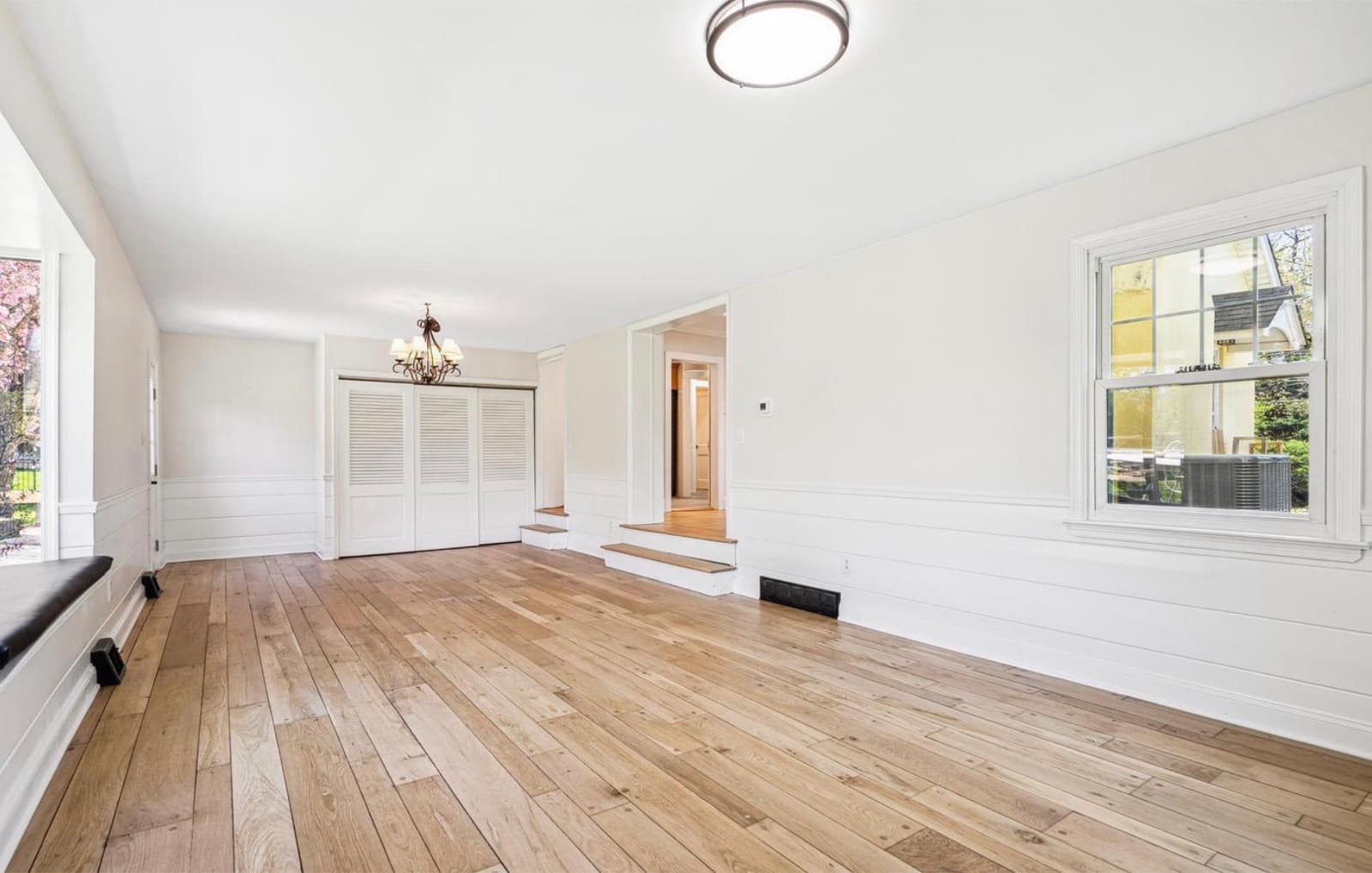 Open family/dining room with hardwood floors