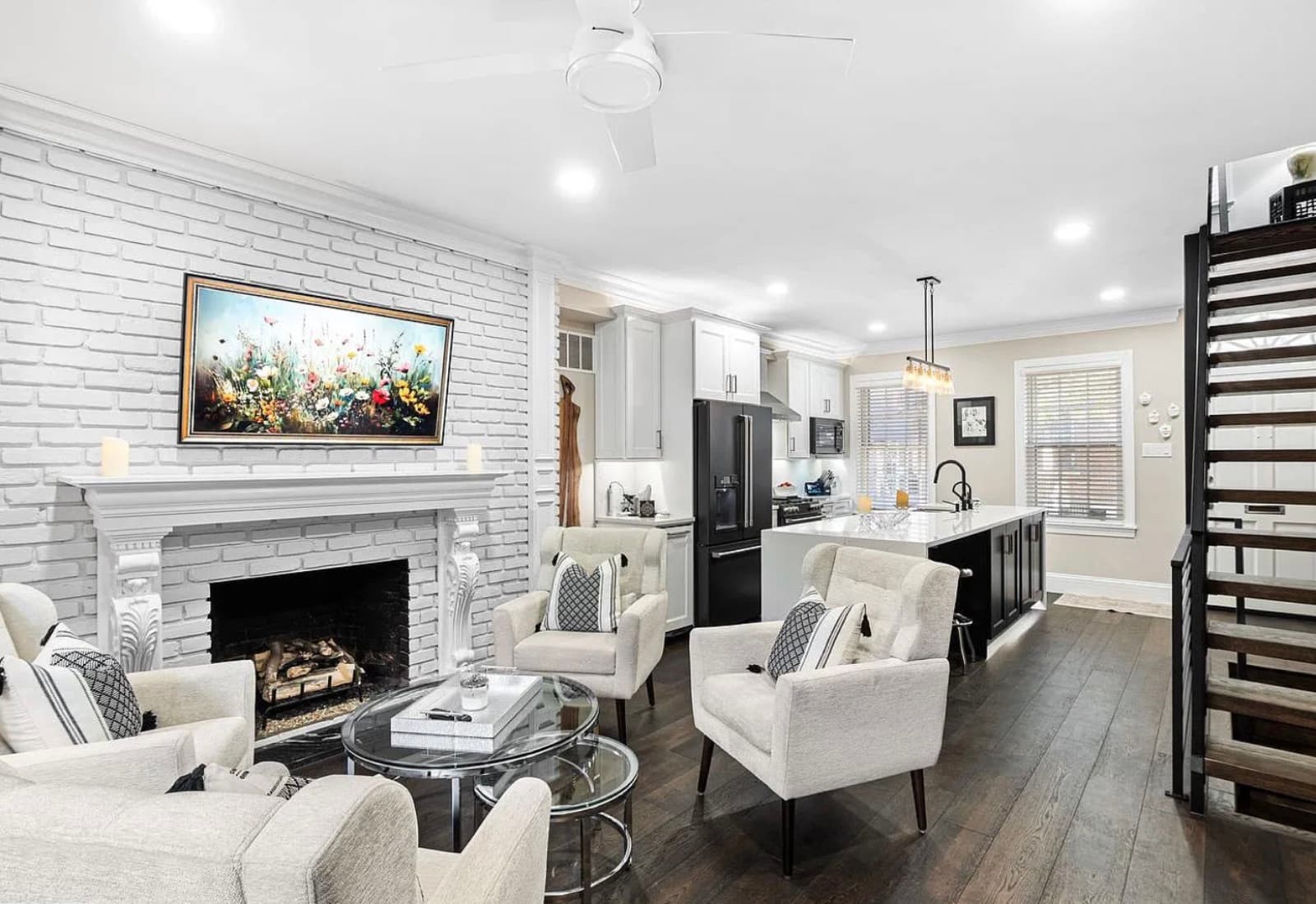 Living room with white brick fireplace