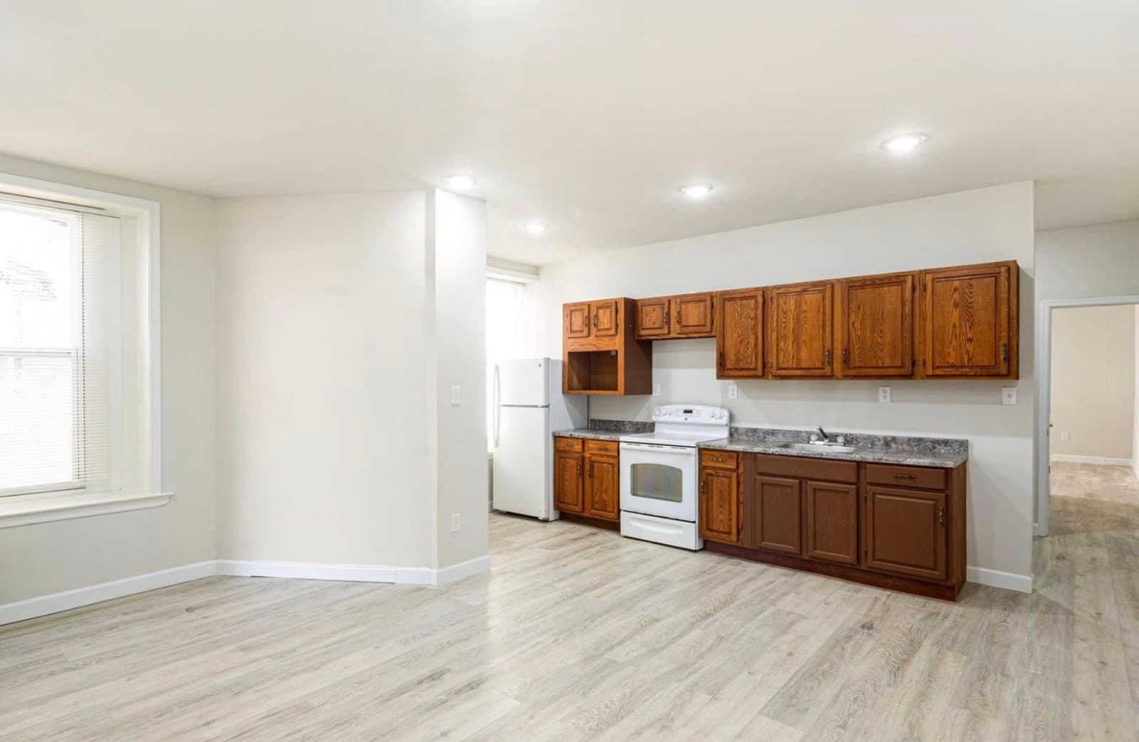 Kitchen with oak cabinets and appliances