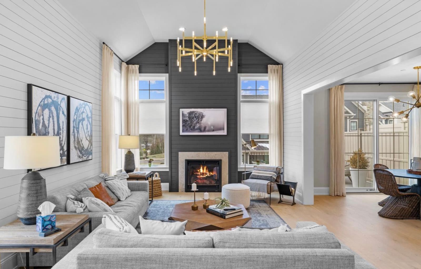 Great room with vaulted ceiling and stone fireplace