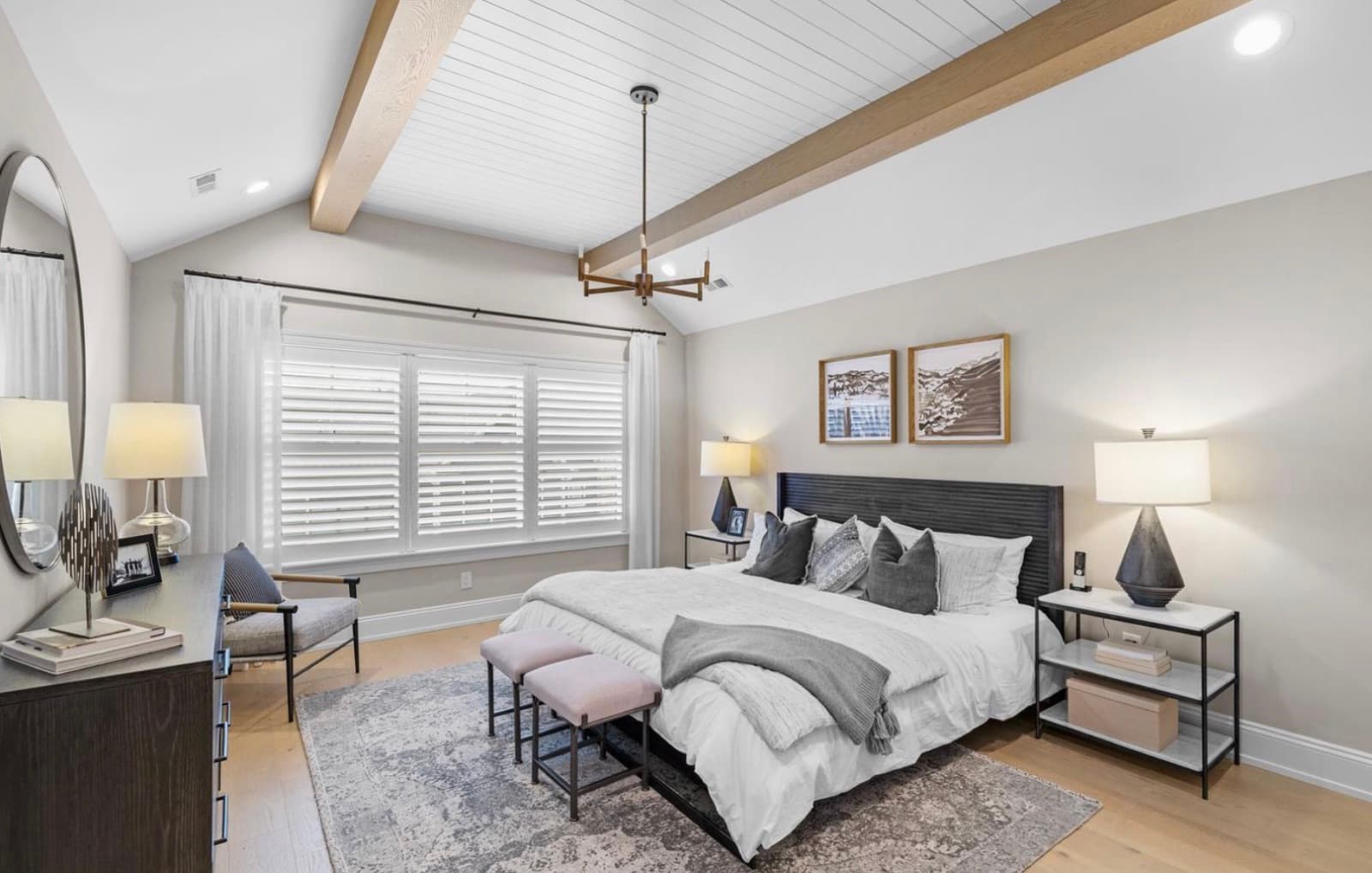 Primary bedroom with vaulted beamed ceiling